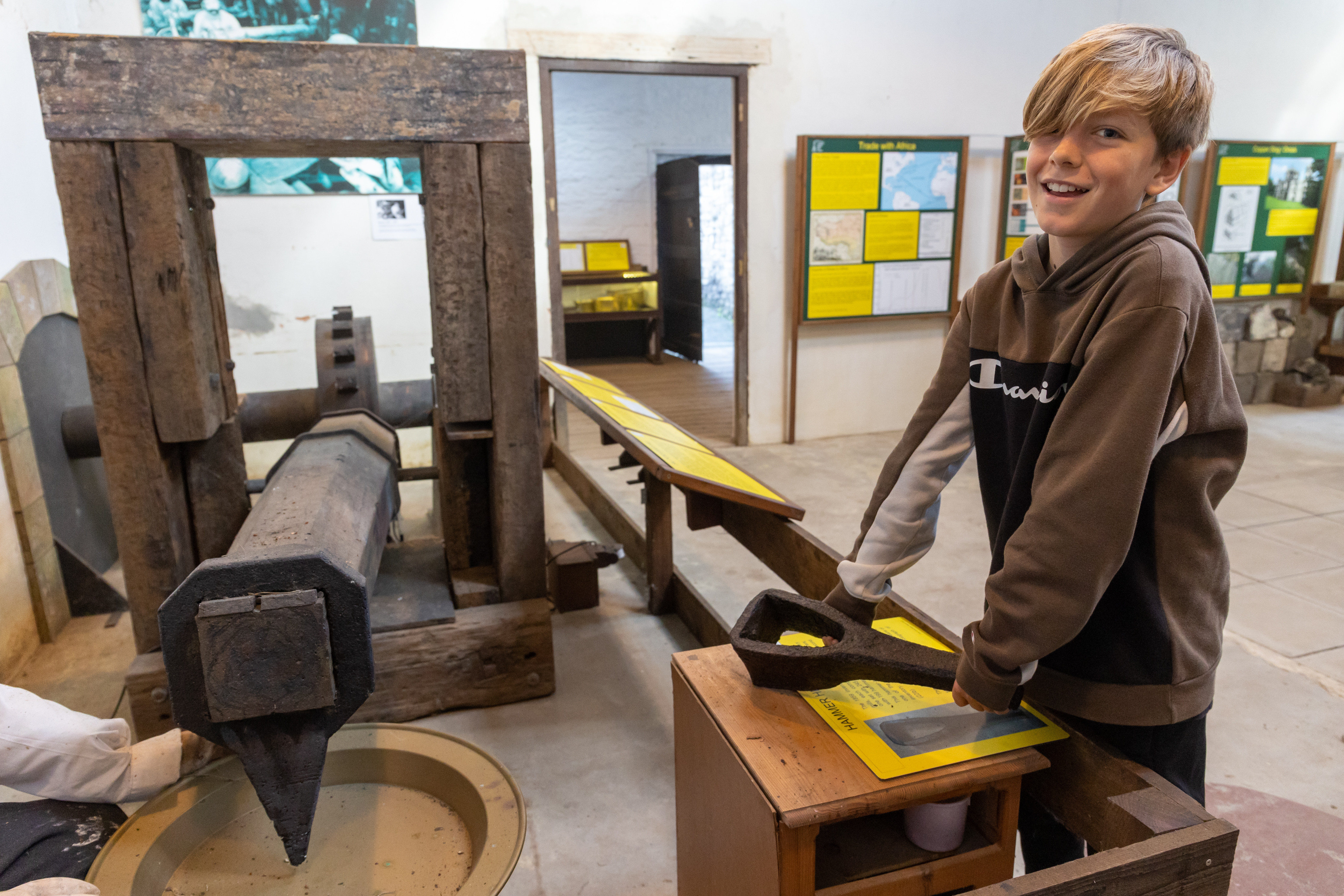 A child looking at objects at Saltford Brass Mill