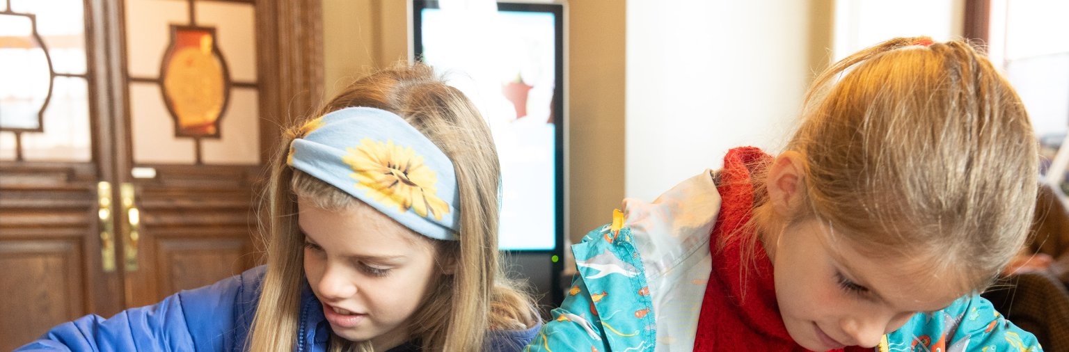 Two young girls doing arts and crafts