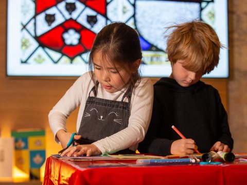 Two children doing crafts at Bath Abbey