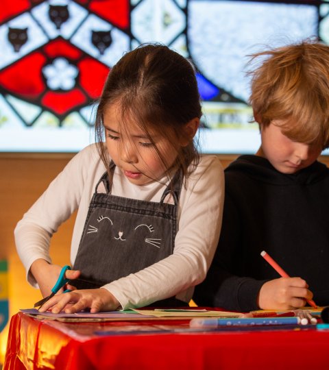 Two children doing crafts at Bath Abbey